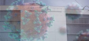 COVID-19 virus over a picture of McLean County Jail